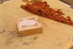 spread the talcum powder around the delft clay